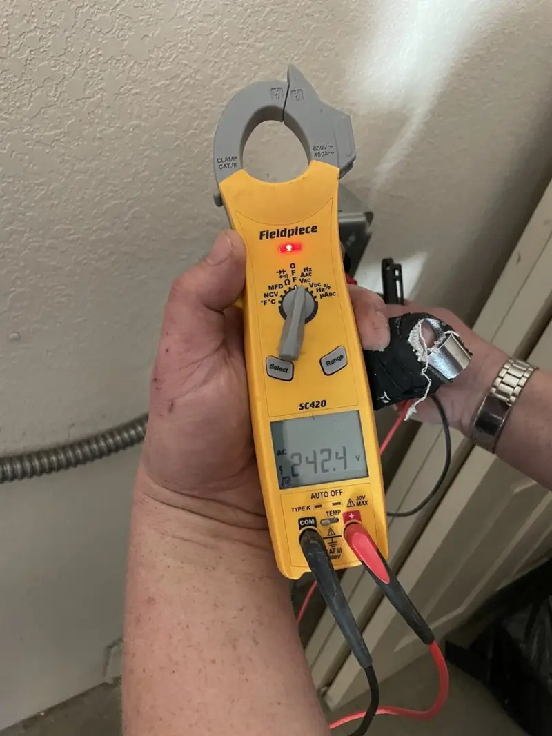 Voltage testing with clamp meter during Whole House Surge Protector in Shelbyville